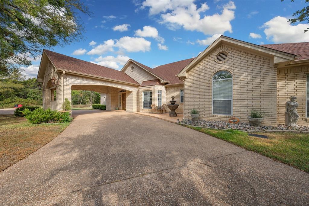 View of front of home featuring a carport