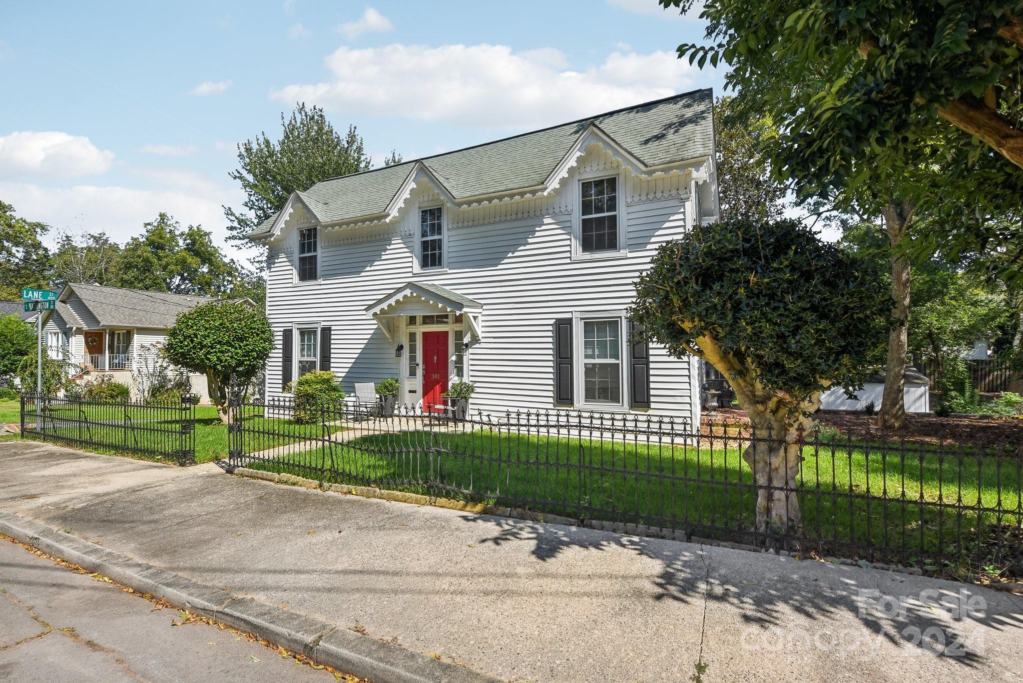 front view of a house with a garden