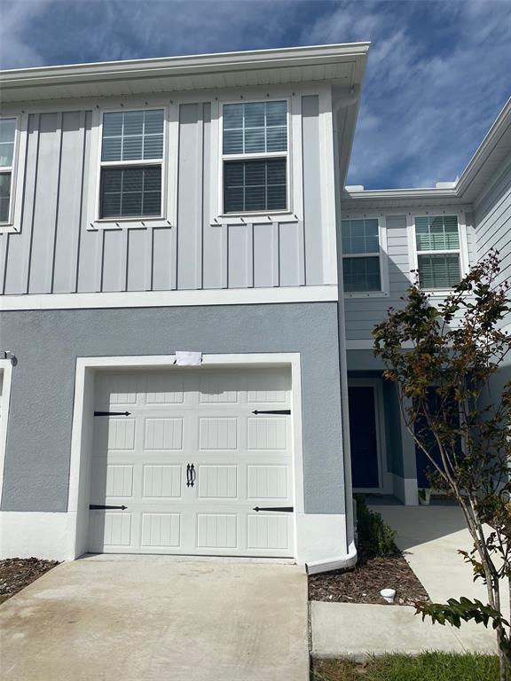 a front view of a house with a garage