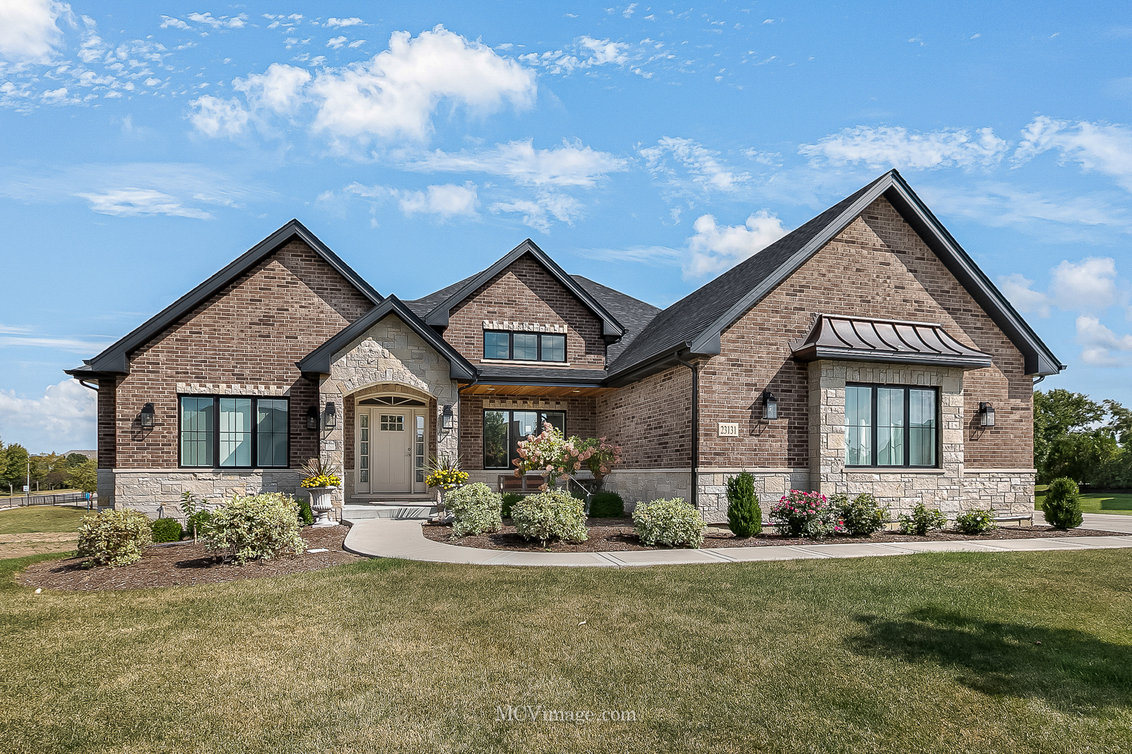 a front view of house with yard and green space