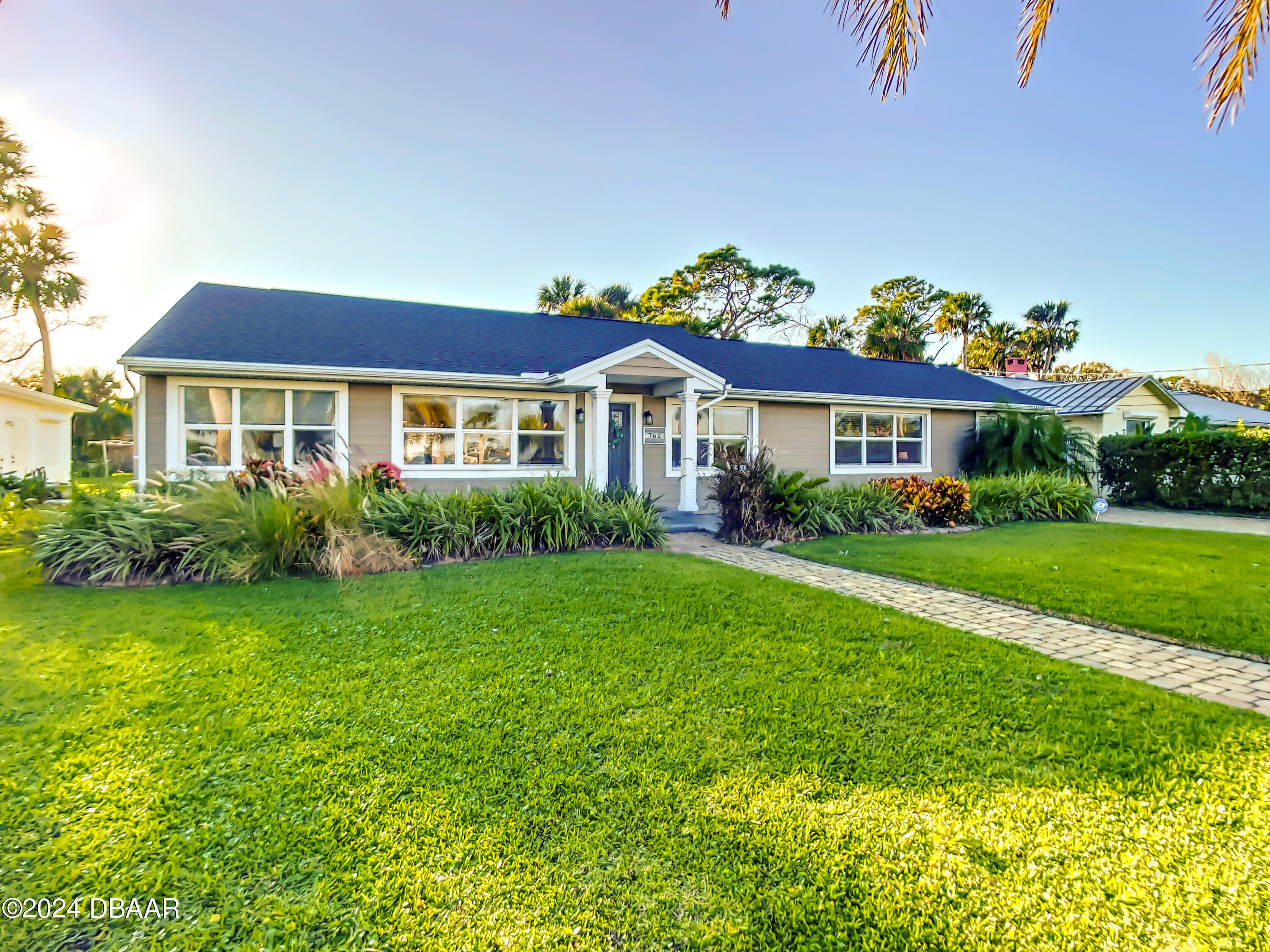 a front view of a house with a yard