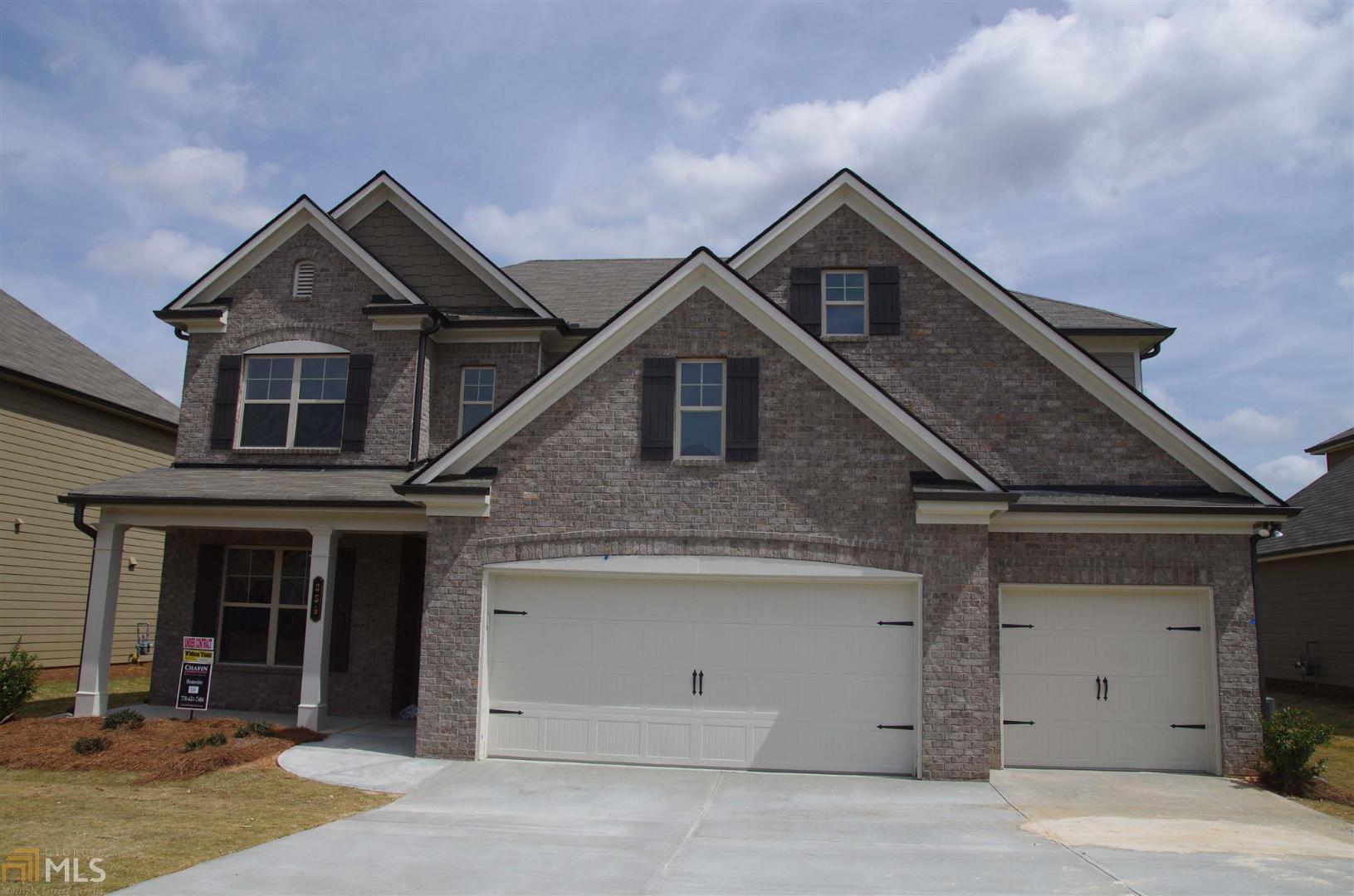 a view of a house with a garage