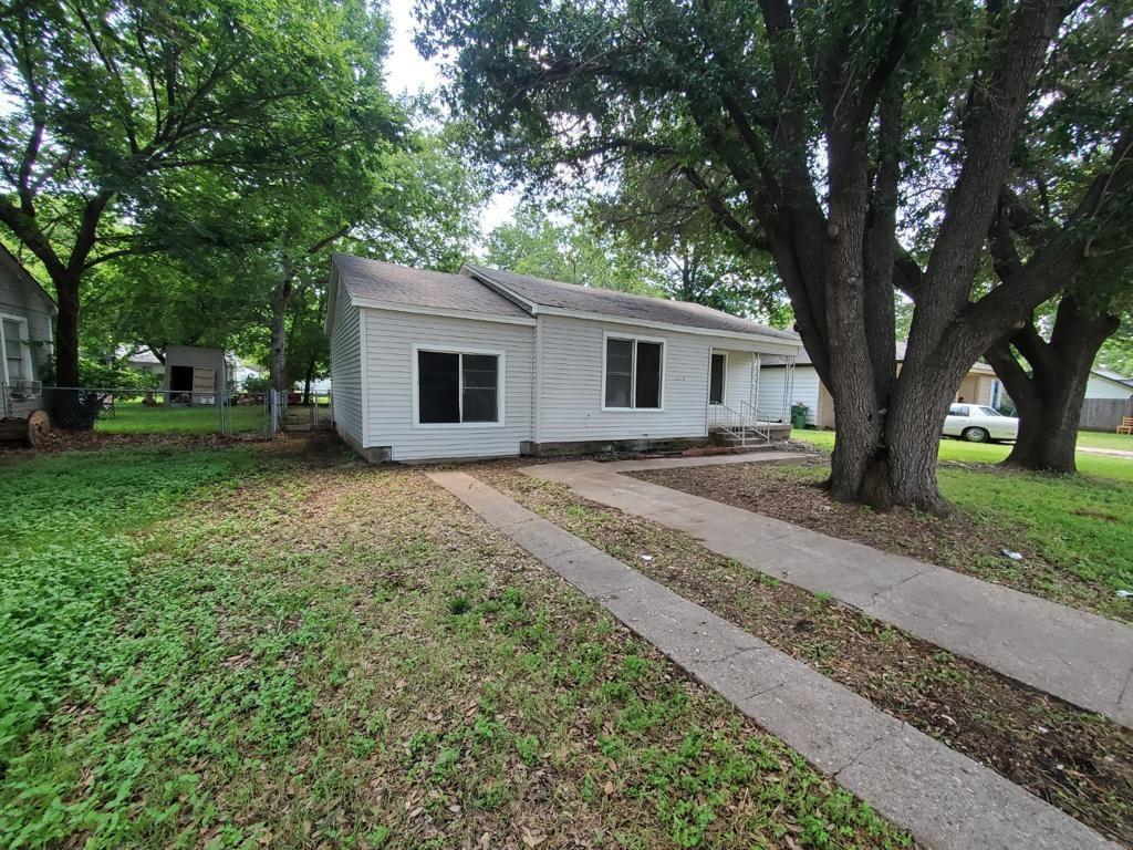 a house with trees in the background