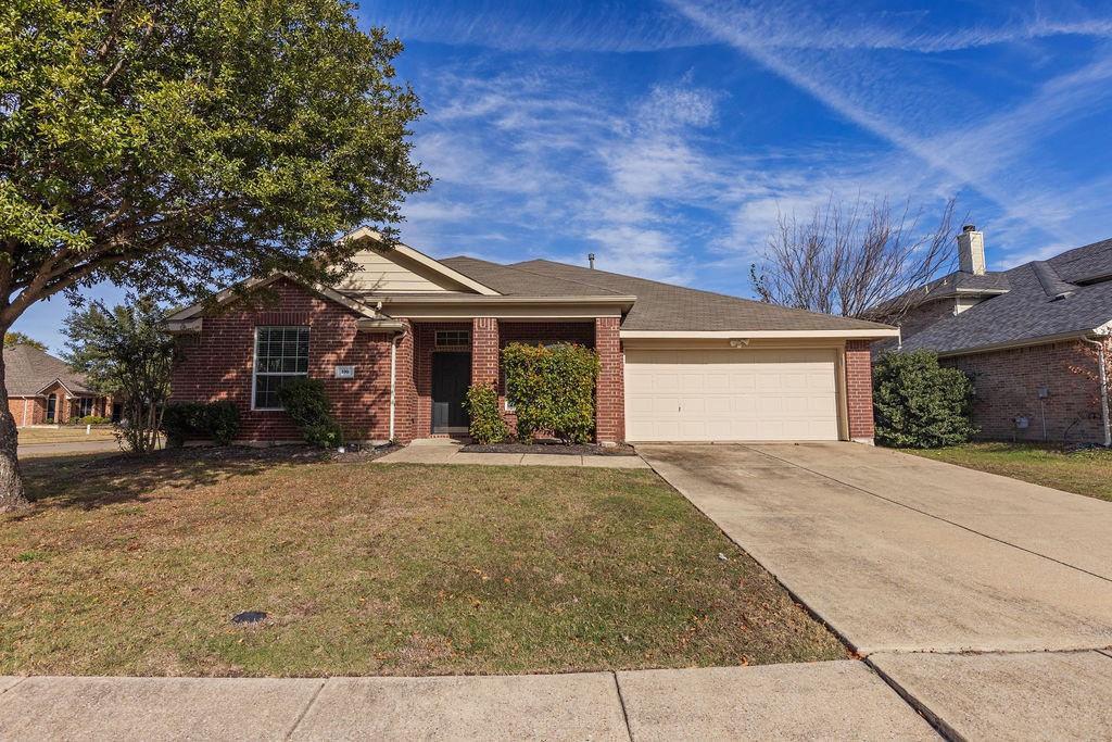 front view of a house with a dry yard