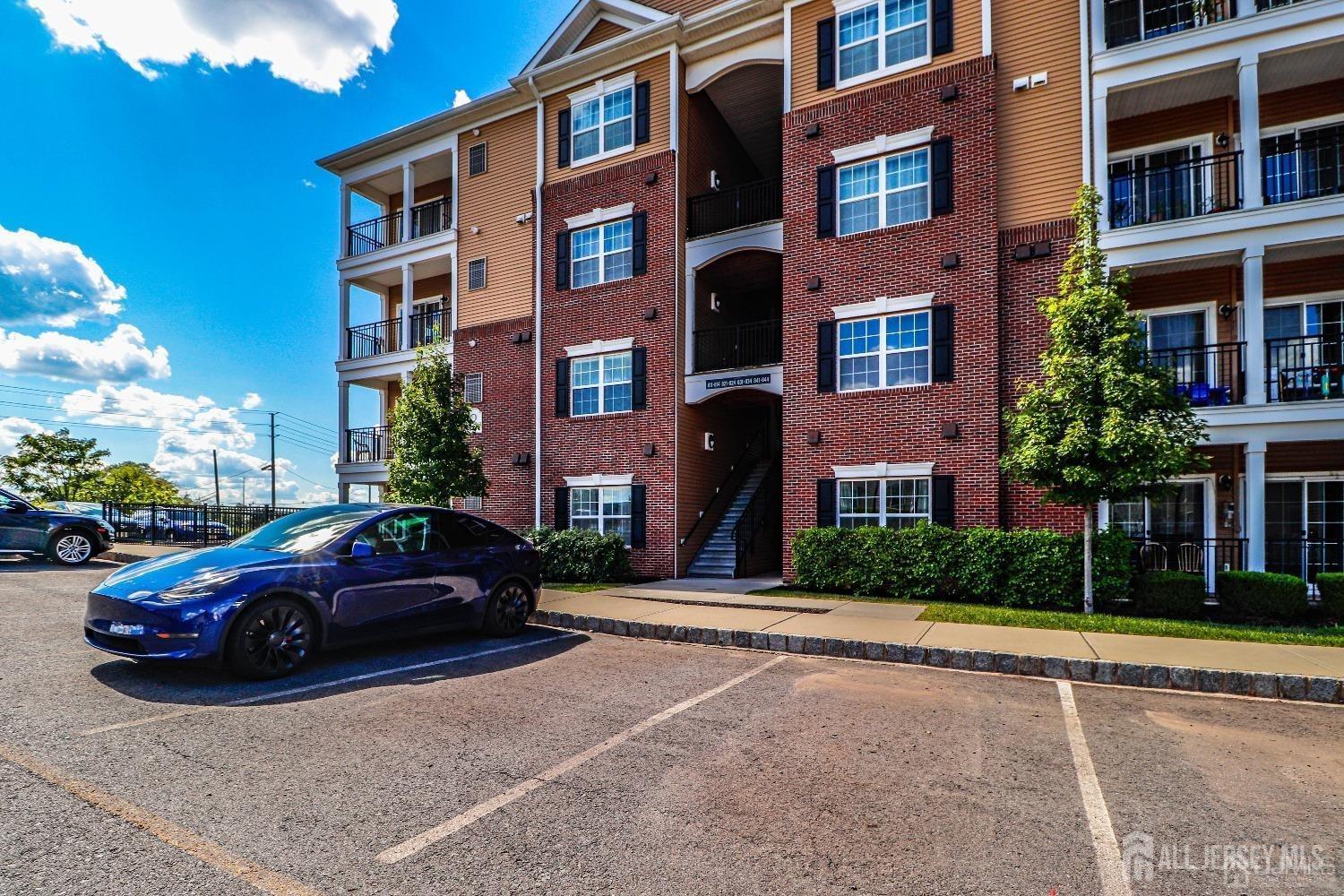 a cars parked in front of a brick building