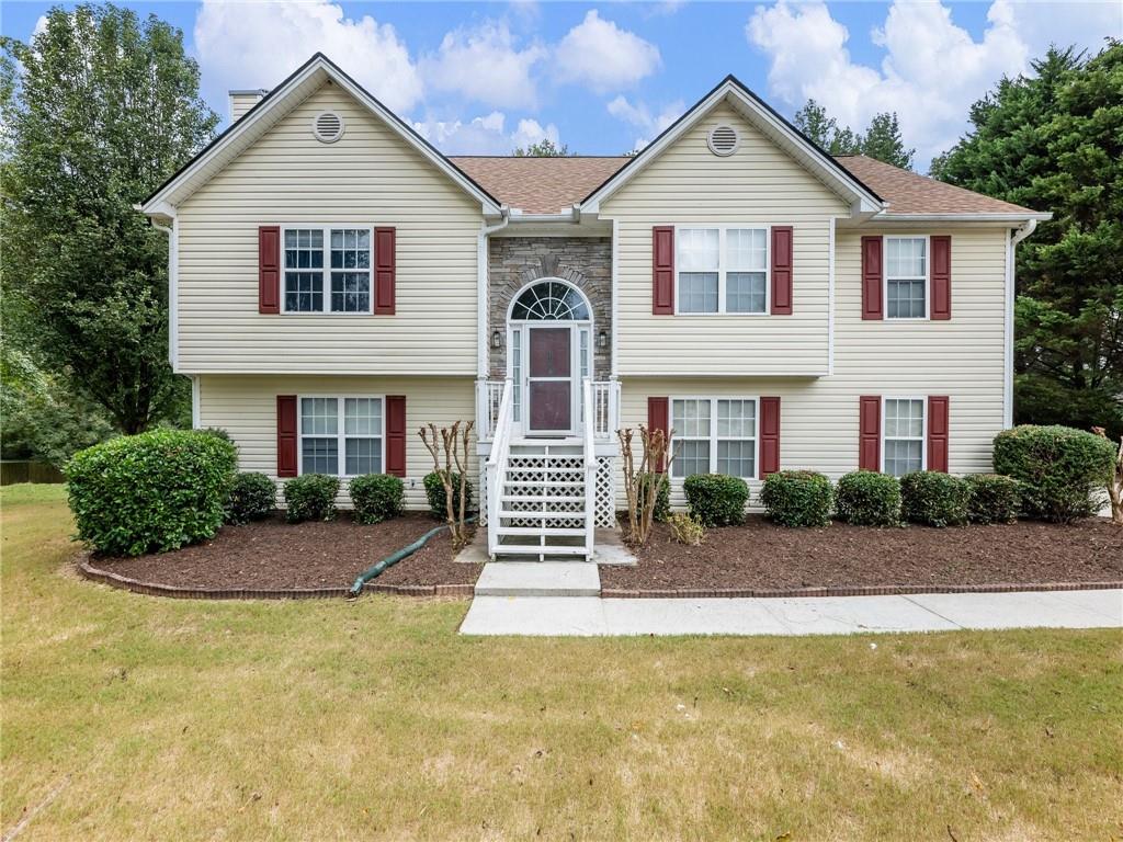 a front view of a house with a yard