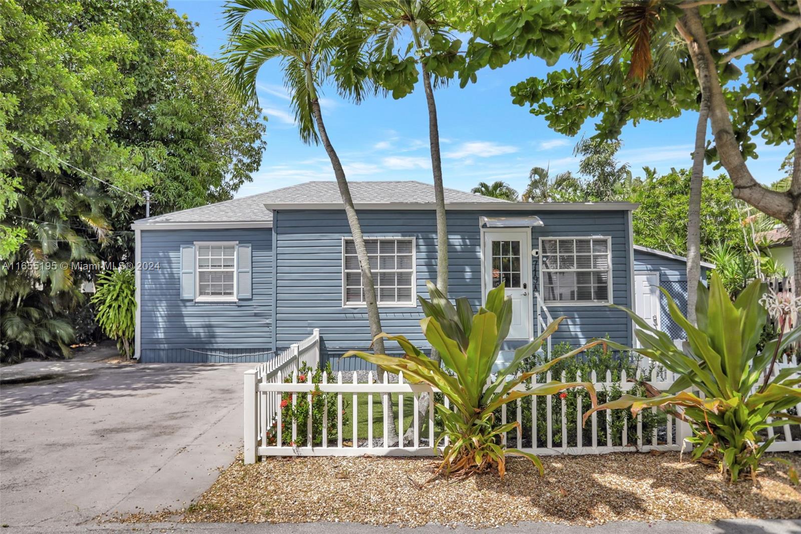 a view of front of house with a yard