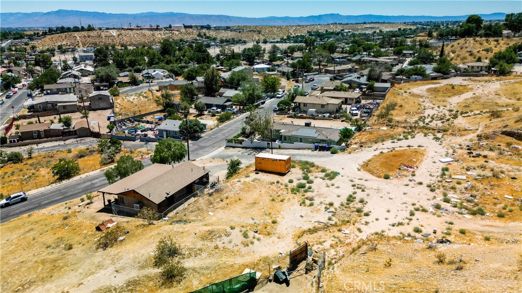 an aerial view of residential houses with yard