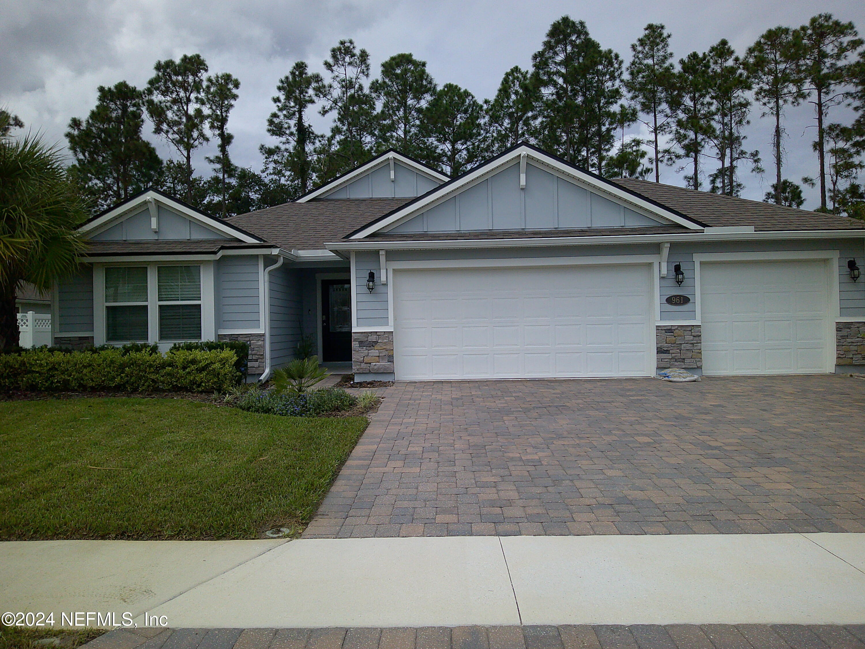 a front view of a house with yard