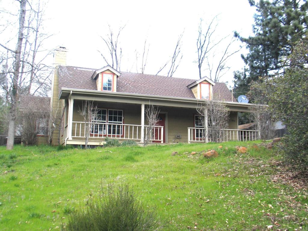 a view of a house with a garden