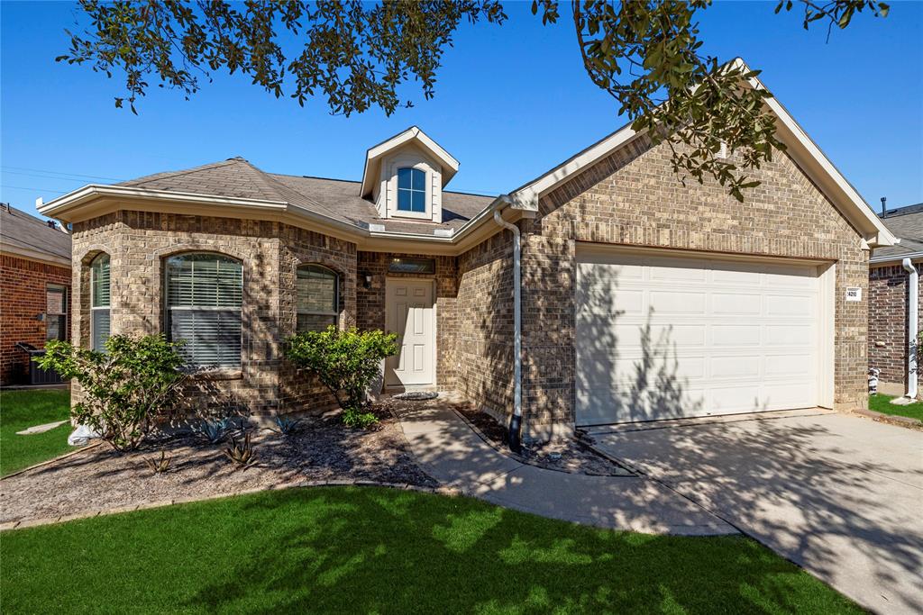 Welcome home to 24210 Courtland Oaks Street in the Grand Harbor community in Katy!