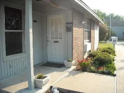 a view of a backyard of the house