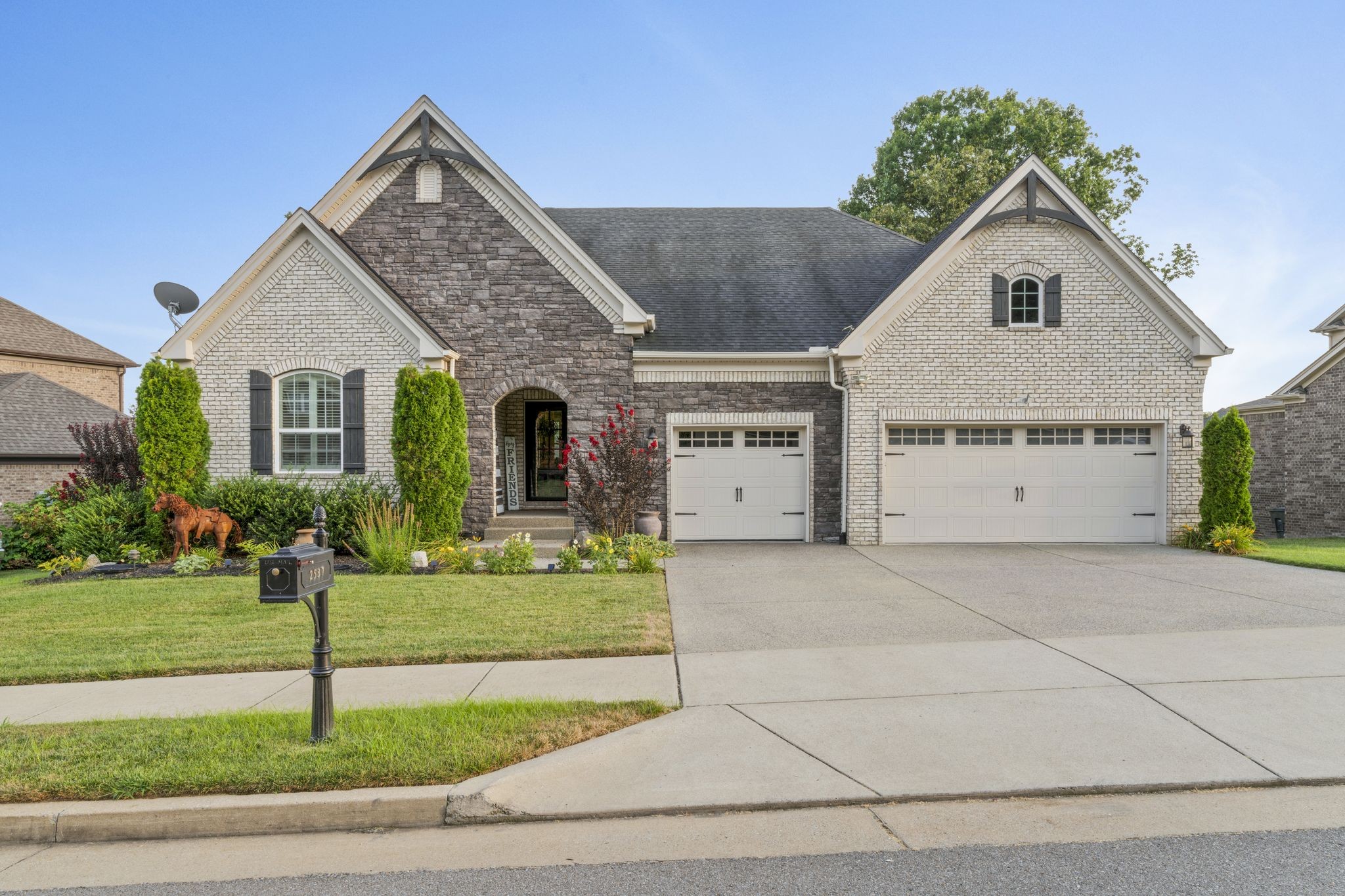 a front view of a house with a yard