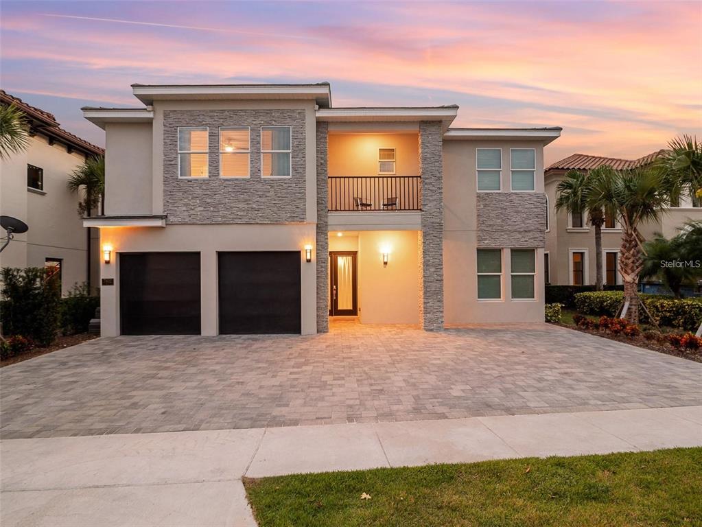 a view of a house with a yard and garage