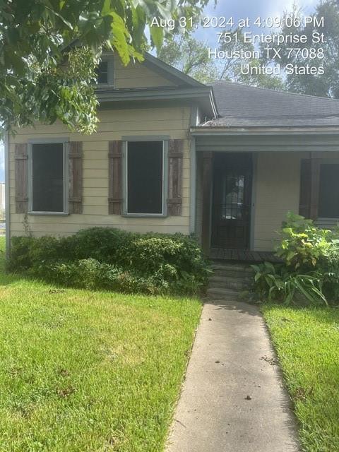 front view of a house with a yard