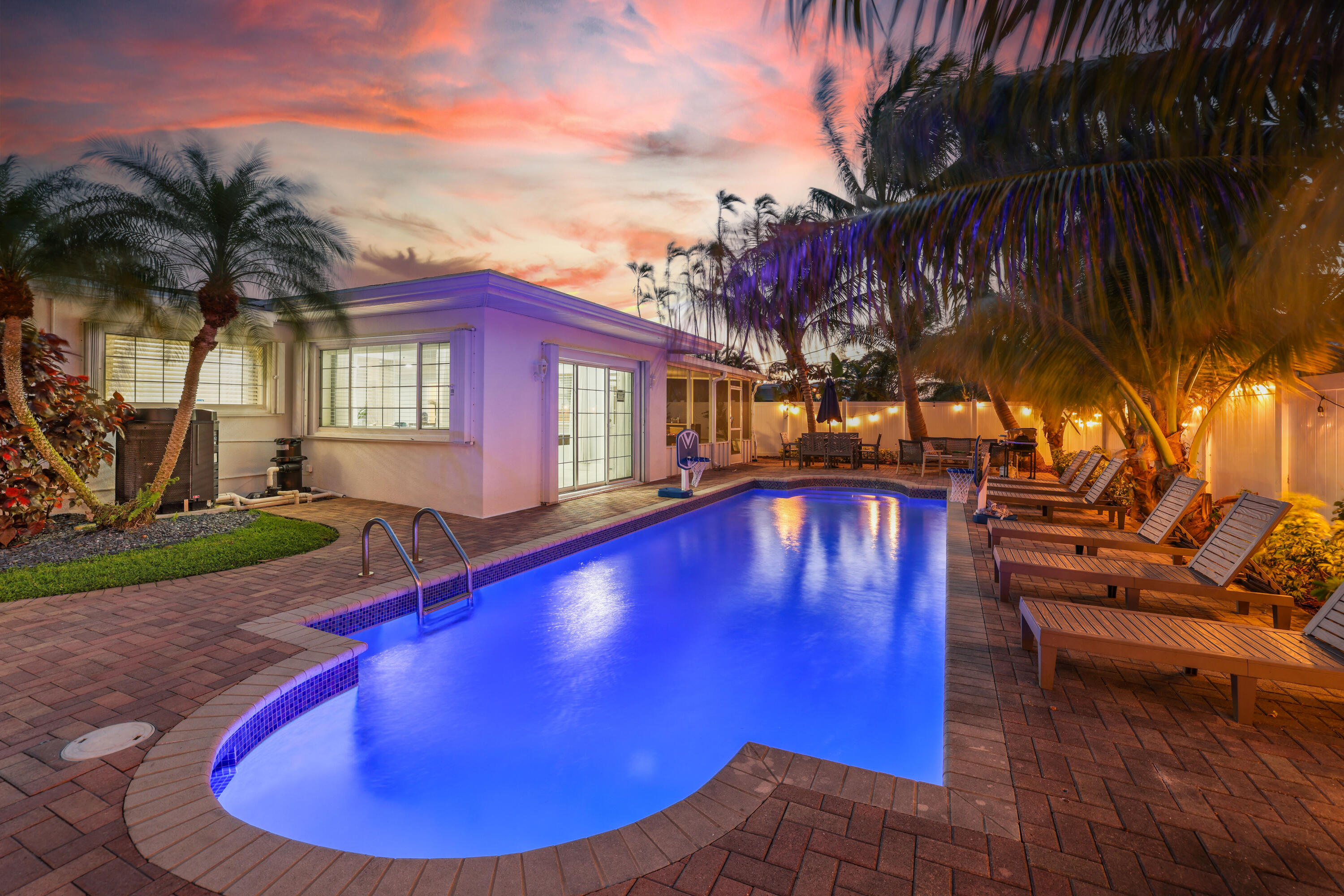 a view of swimming pool with seating area