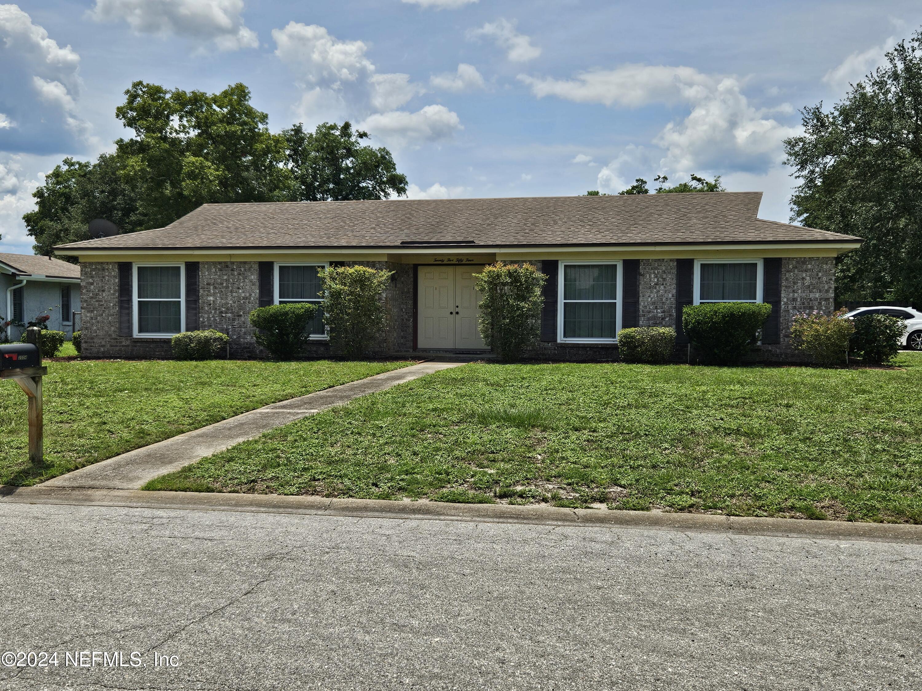 front view of a house and a yard