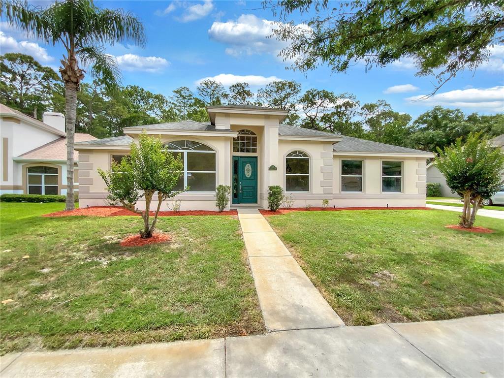 front view of a house with a yard