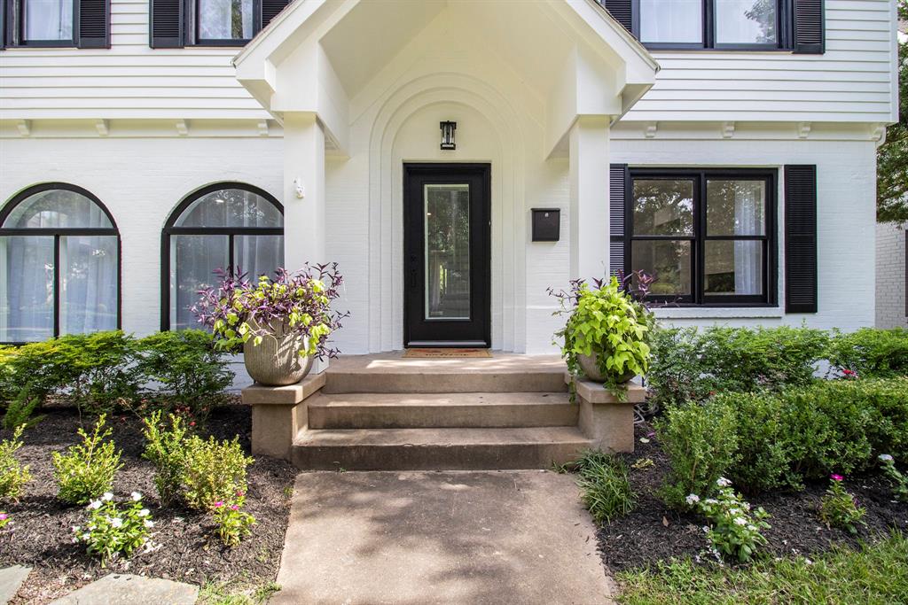 Welcome to a refreshed elegance with this charming home, boasting a freshly painted exterior and an inviting front porch.