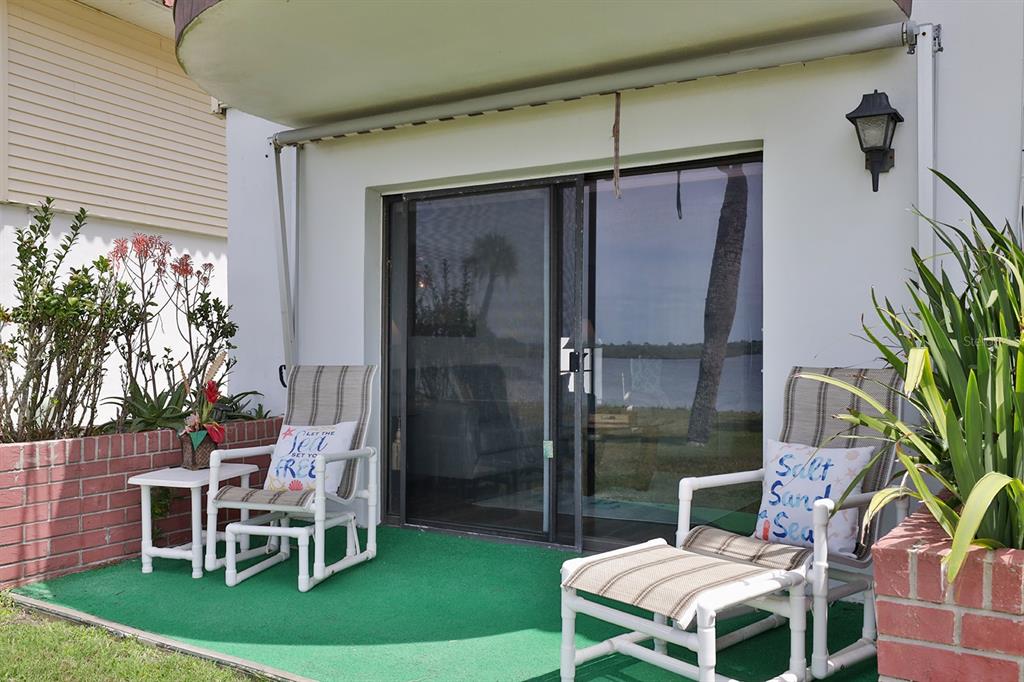 a patio with table and chairs