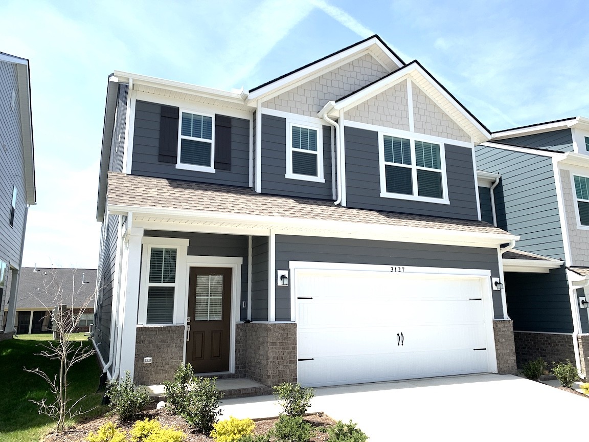 a front view of a house with a garage