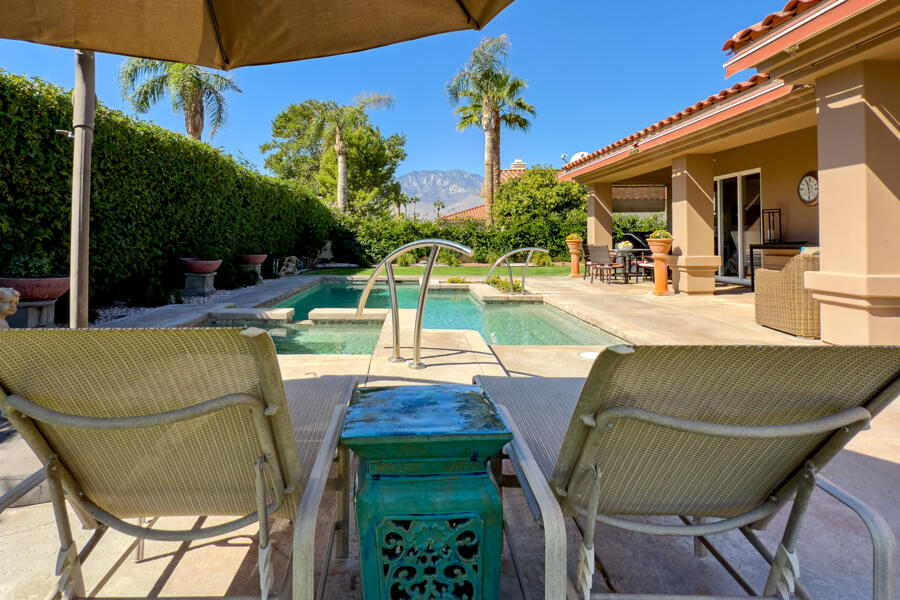 a view of a patio with swimming pool