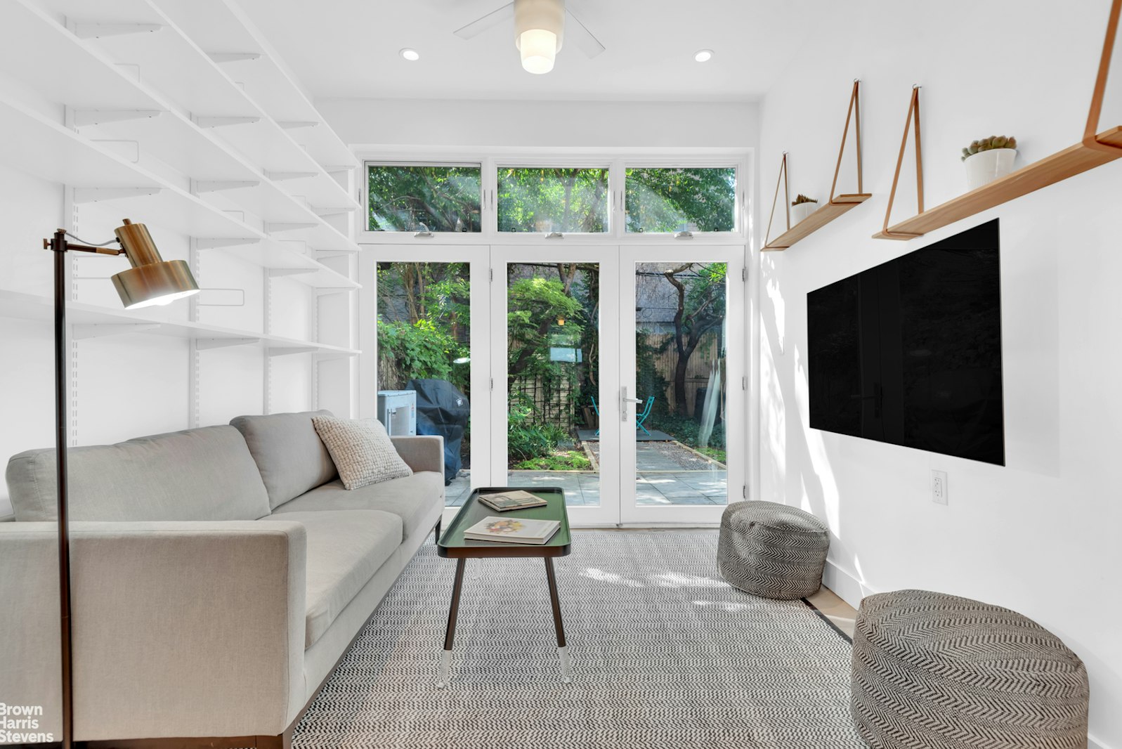 a living room with furniture fireplace and a flat screen tv