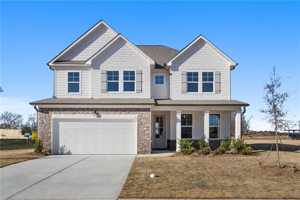 front view of a house with a yard