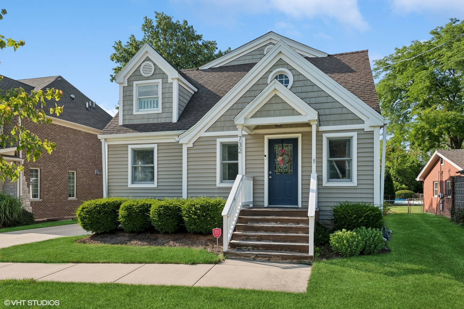 a front view of a house with a yard