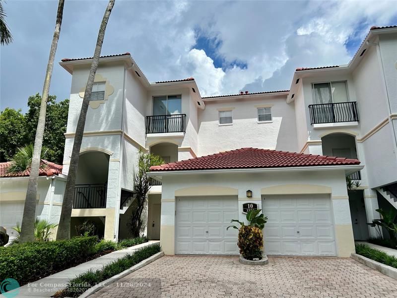 a front view of a house with a garage