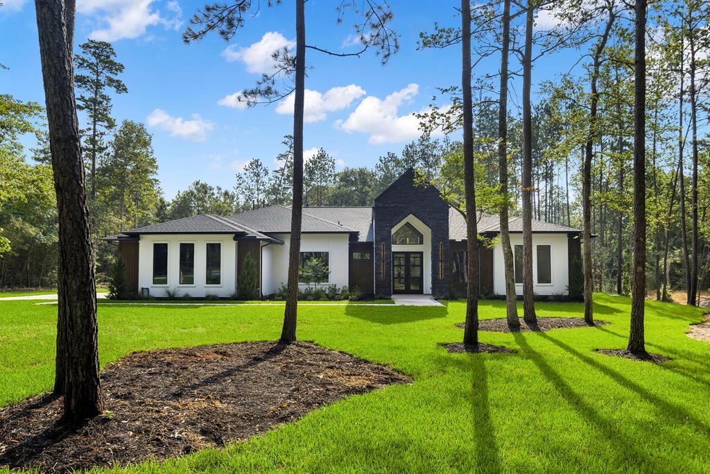 a view of a house with a yard in front of the house