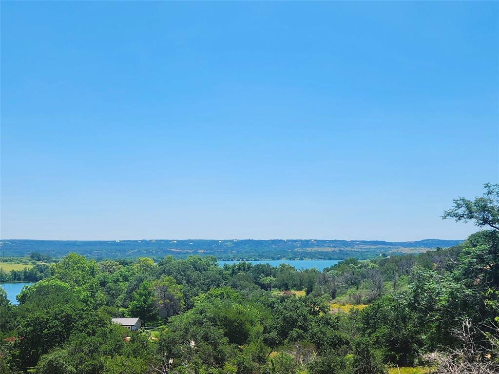 a view of a field with a city