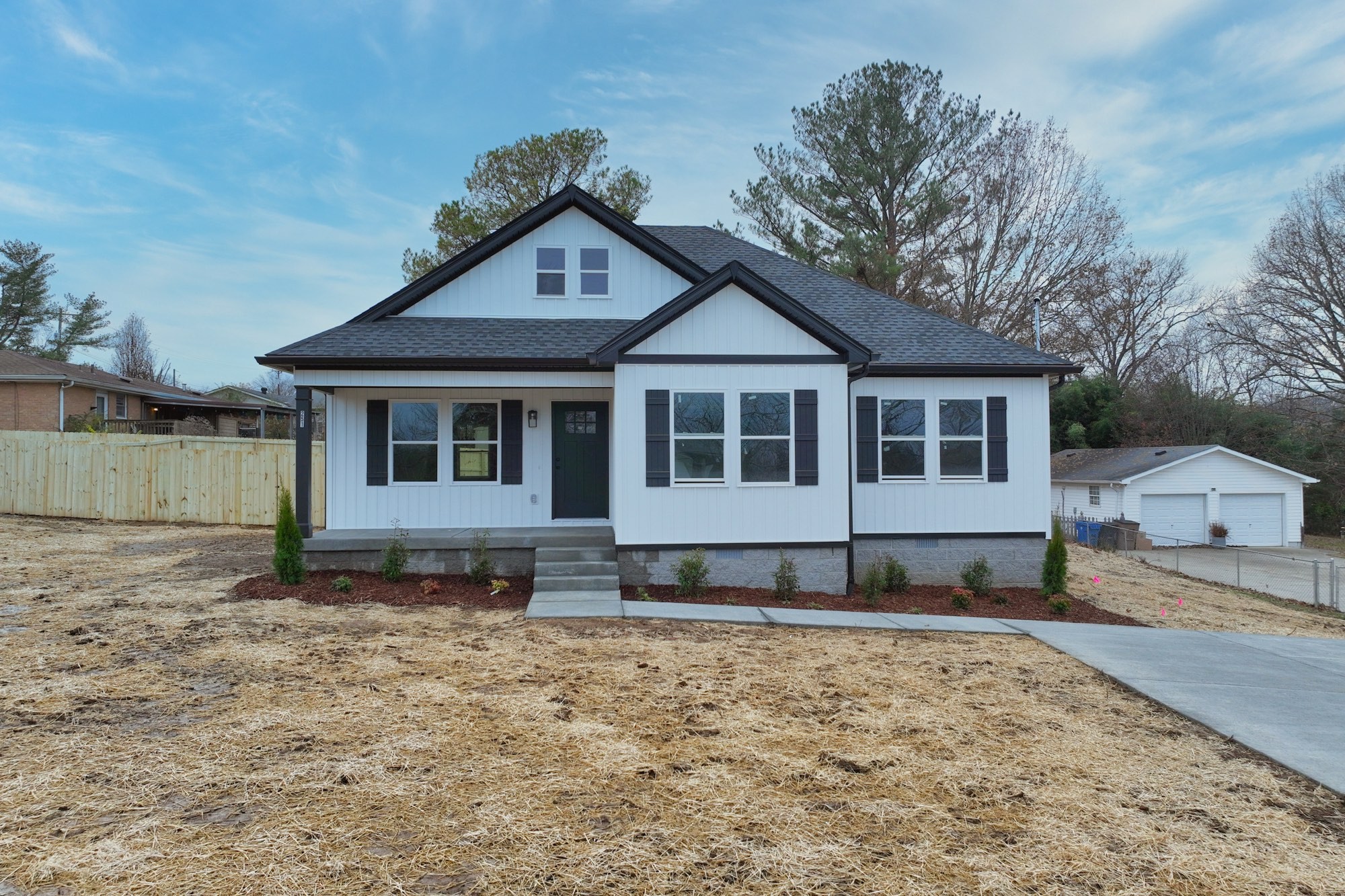 a house with trees in the background