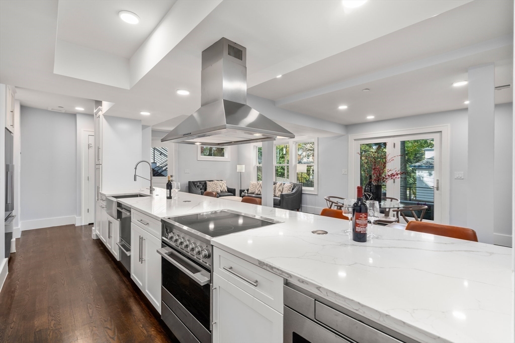 a kitchen with counter top space a sink and appliances