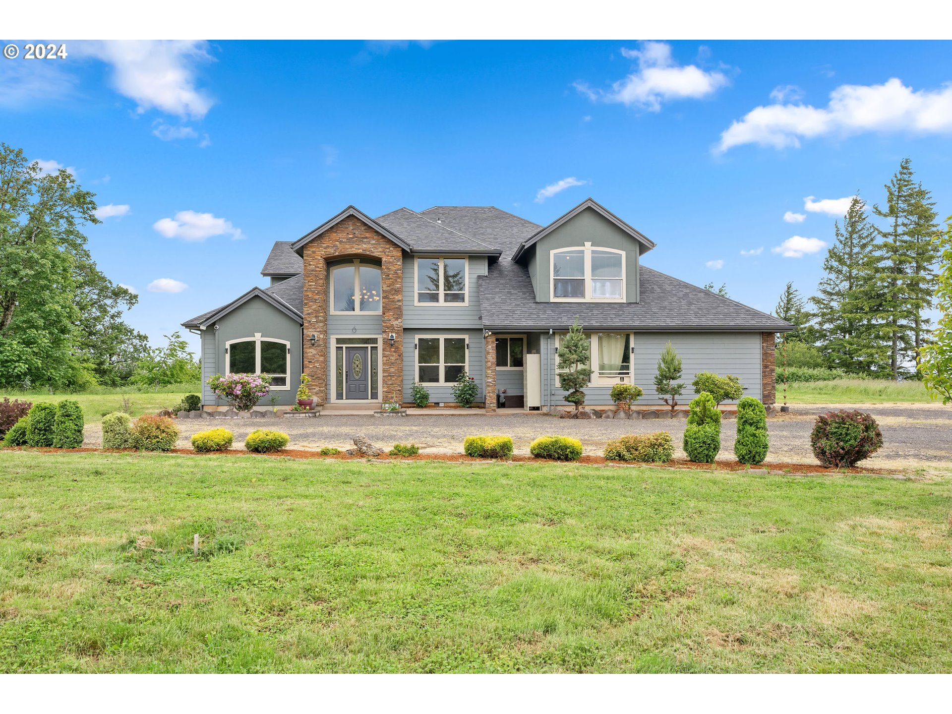 a front view of a house with a yard