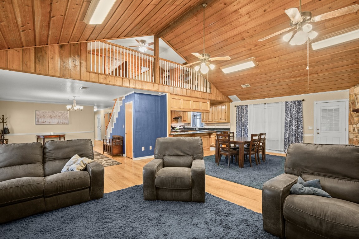 a living room with furniture and a ceiling fan