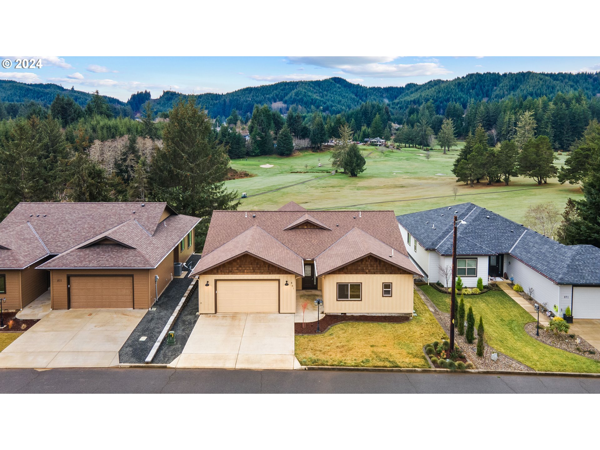 a aerial view of a house with a yard