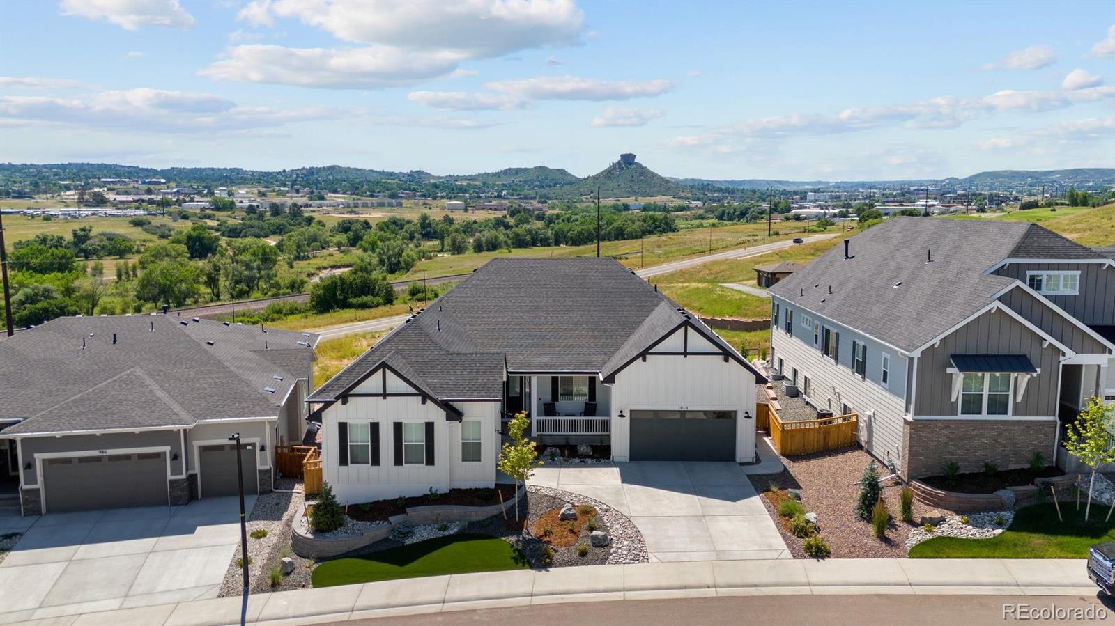 an aerial view of a house with a ocean view