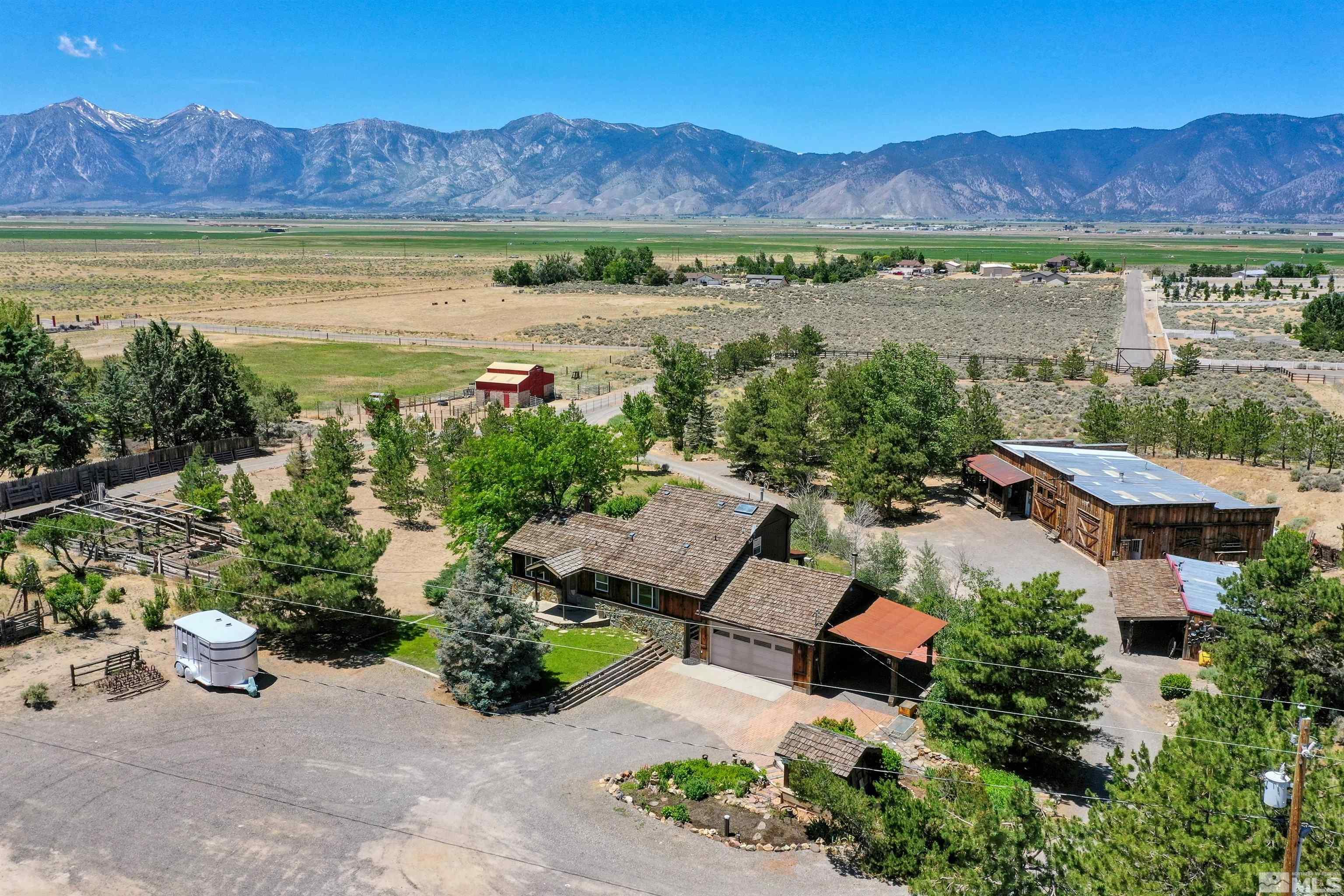 an aerial view of a house and outdoor space