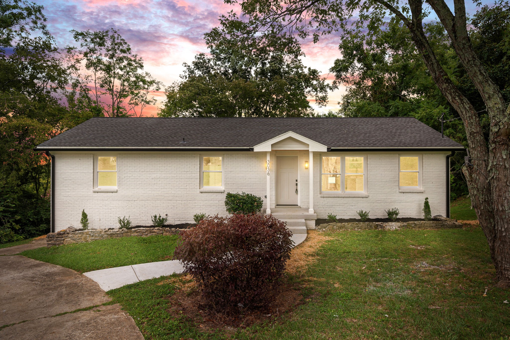 a front view of a house with a yard