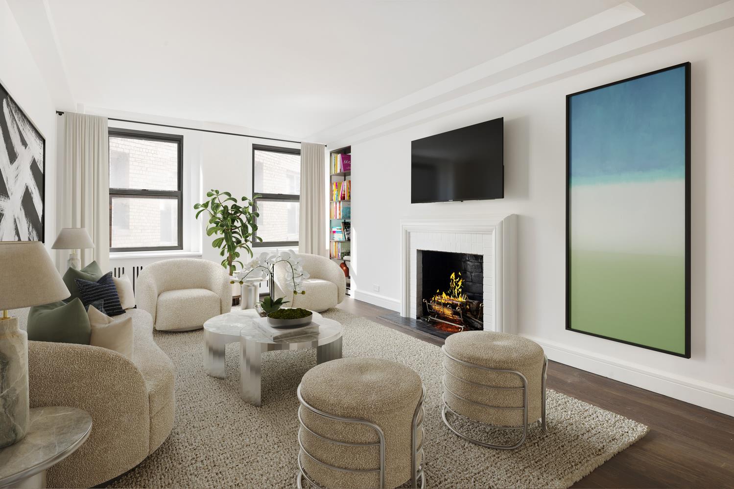 a living room with furniture fireplace and window