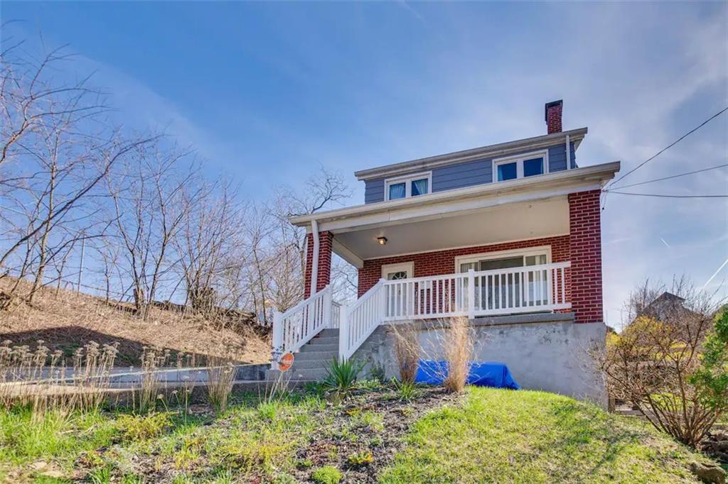 a view of a house with wooden fence