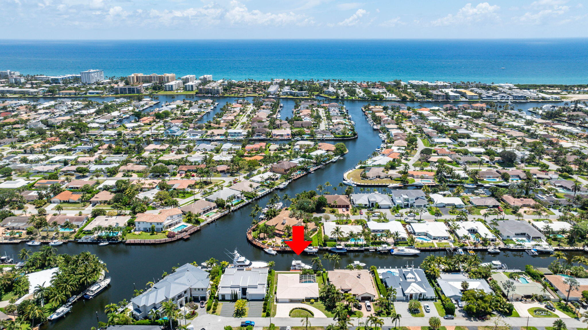 an aerial view of residential building and lake