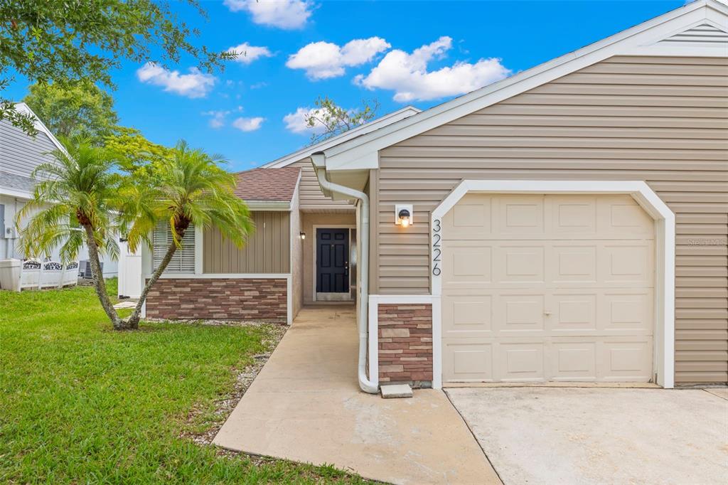 a view of a house with a yard