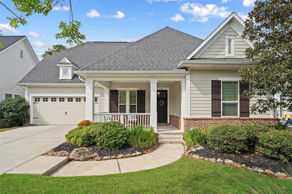 1.5 story craftsman style home featuring a spacious front porch