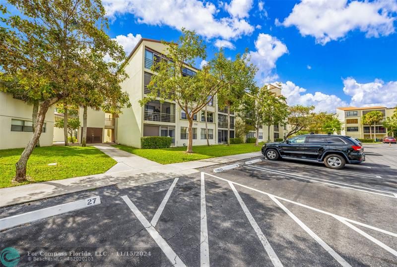 a view of a parked cars in front of a building