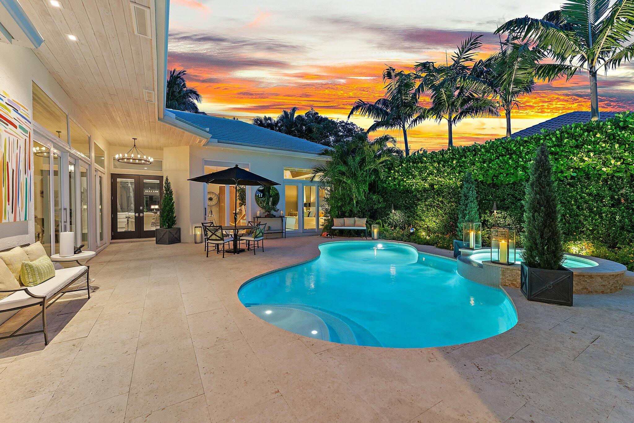 a view of a swimming pool with an outdoor seating