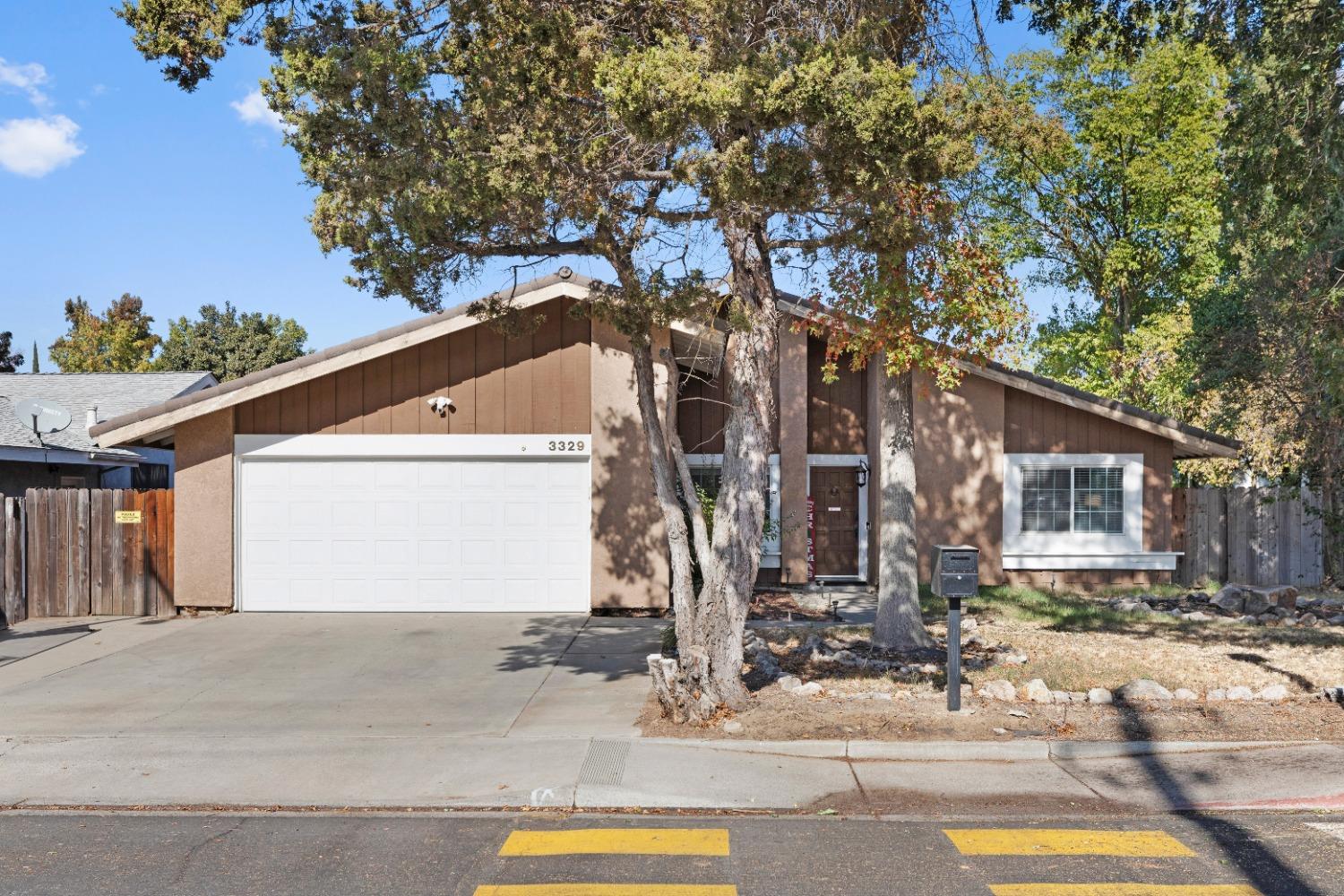 a front view of a house with street