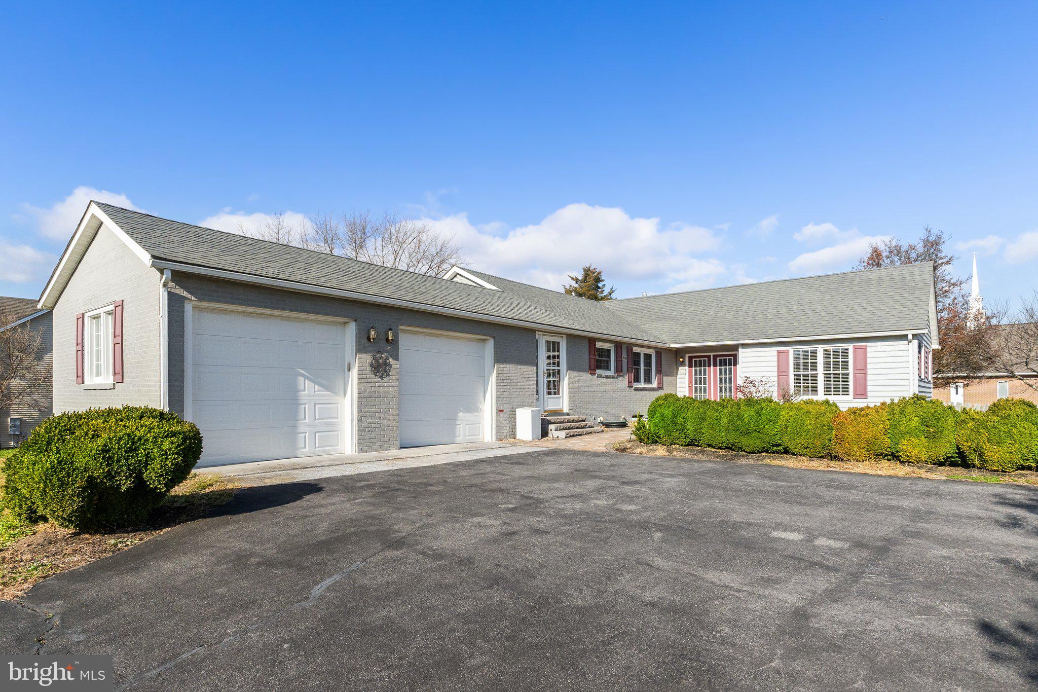 a front view of a house with a garage