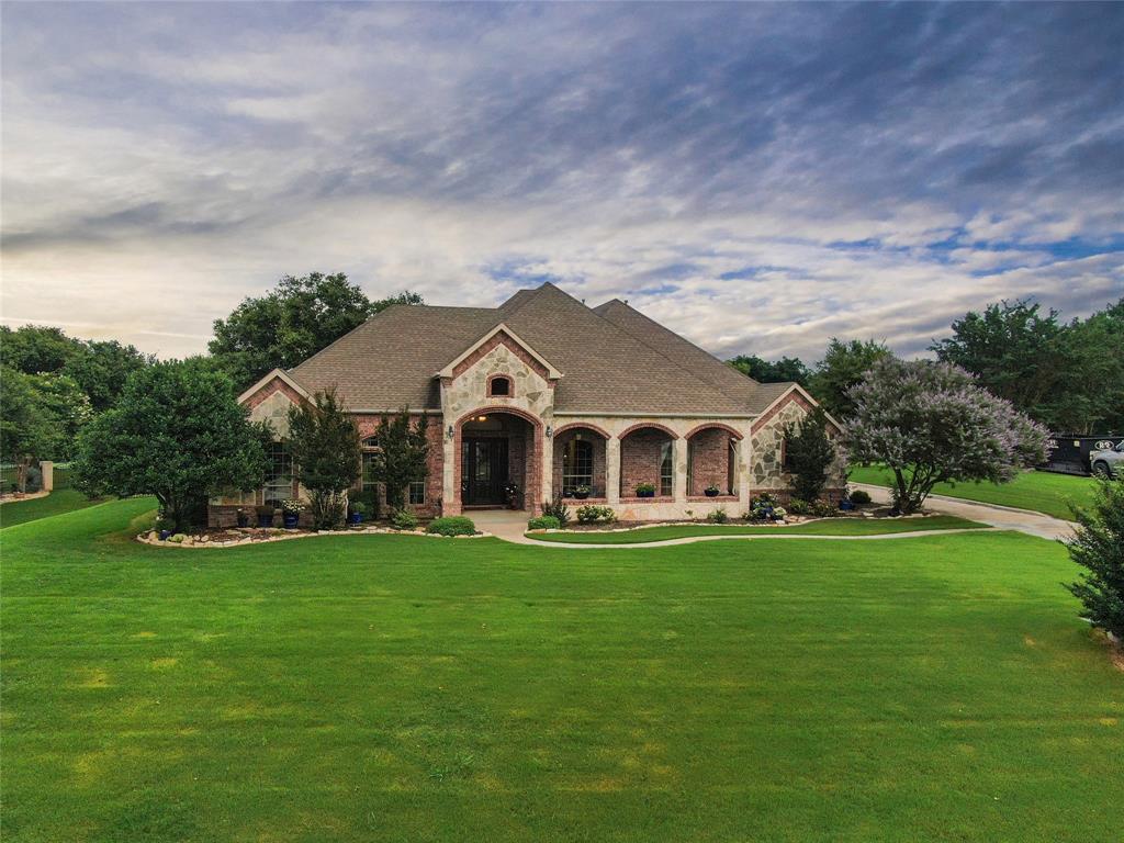 a front view of a house with a yard